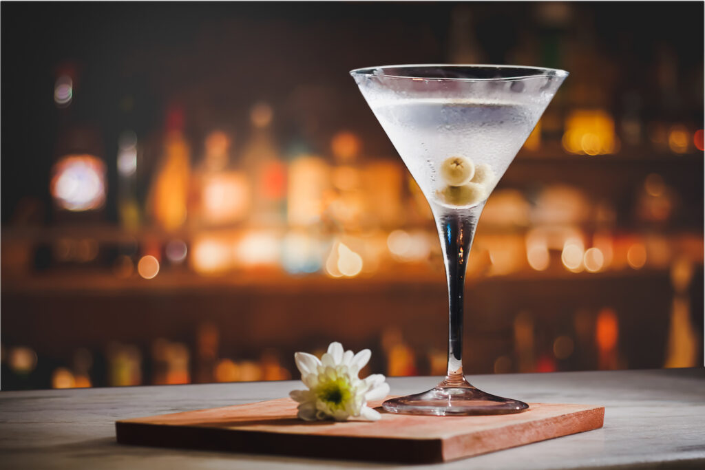 Photograph of a martini at a bar.